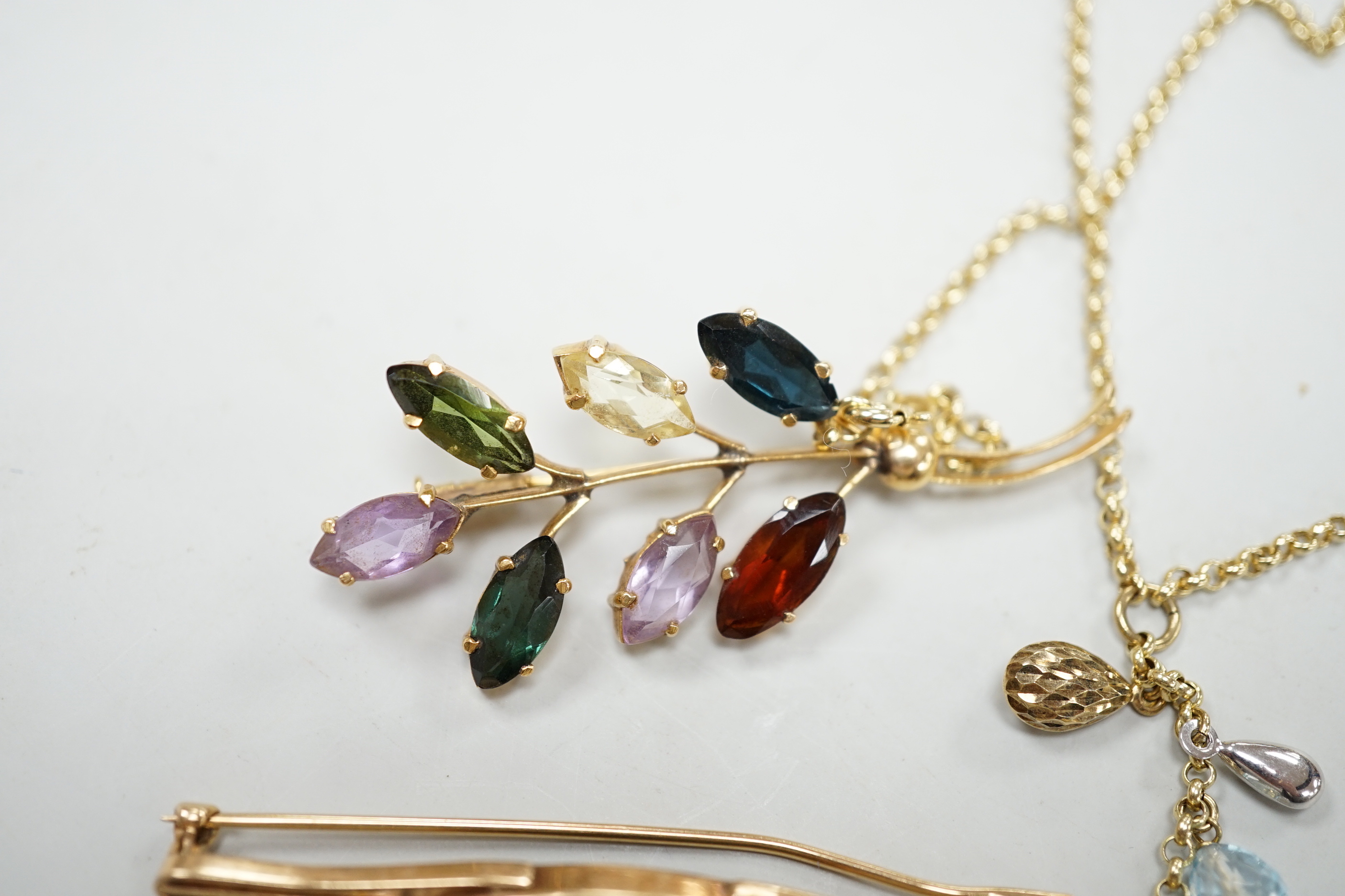 Three modern yellow metal and gen set brooches including 9ct gold and a modern 9ct gold and gem set necklace, gross weight 16.8 grams.
